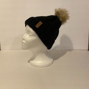 Black 100 acrylic winter hat with tan ball on top